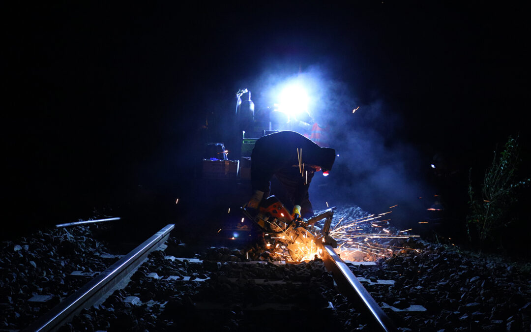 Thermite welding works on a railroad during night time